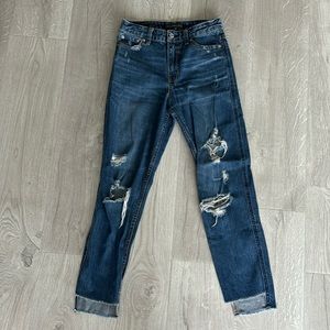 Abercrombie high rise ripped jean in medium wash. Frayed hem size 24